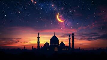 Islamic mosque at sunset with crescent and stars photo