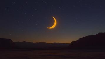 The moon is seen in the sky above a mountain range photo