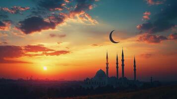 The sun rises over a mosque and crescent photo