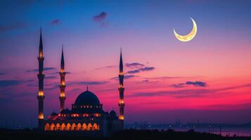 The moon and mosque in the sky at sunset photo