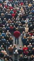 A man standing in the middle of a crowd photo