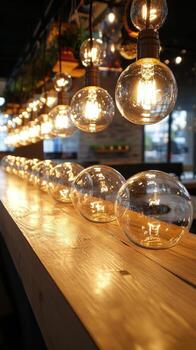 A long line of light bulbs on a bar photo