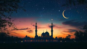 A mosque at night with a crescent and stars photo