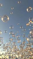 A large group of bubbles floating in the air photo