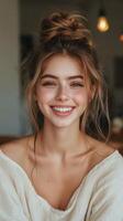 A woman with a messy bun and a smile photo