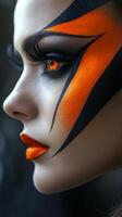 A woman with orange and black makeup photo
