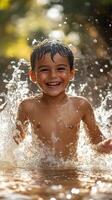 A young boy is splashing in the water photo