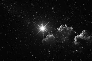 A black and white photo of a star and clouds