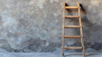 A ladder against a wall with a concrete floor photo