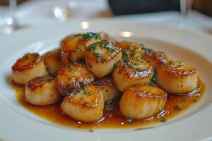 A plate of scallops on a table photo