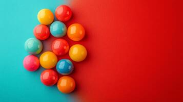 Colorful candy balls on a red and blue background photo