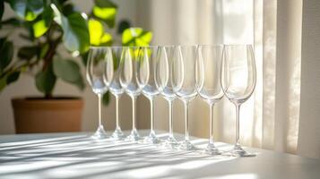 A row of empty wine glasses on a table photo