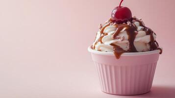 A cup of ice cream with a cherry on top photo