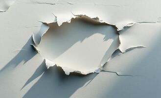 A hole in a wall with a shadow photo