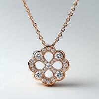 A rose gold necklace with a diamond flower photo