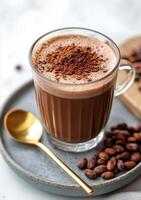 Cocoa latte with chocolate powder and coffee beans on a plate photo