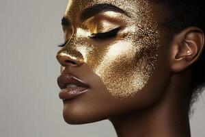 A woman with gold makeup on her face photo