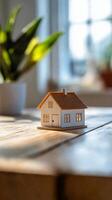 House model on table in front of window photo