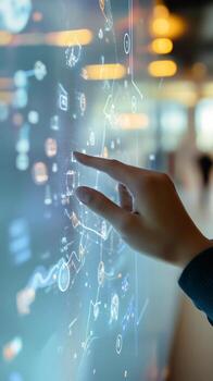 A person touching a digital screen with a business diagram photo