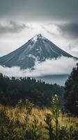 A mountain is seen in the distance with clouds photo