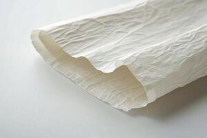 A white sheet of paper with a folded edge photo