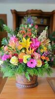 A colorful arrangement of flowers in a wooden vase photo
