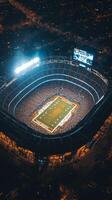 An aerial view of a football stadium at night photo