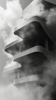 A black and white photo of a building with clouds