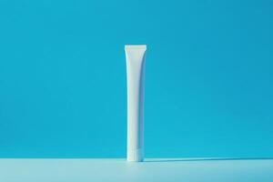 A tube of toothpaste on a blue background photo