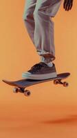 Skateboarder in motion on orange background photo