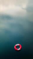 A life preserver floating in the water photo