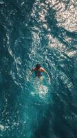 A man swimming in the ocean photo