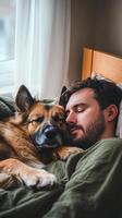 A man sleeping with his dog in bed photo