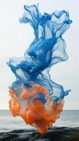 A blue and orange liquid is floating on the ocean photo