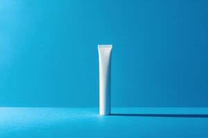 A tube of toothpaste on a blue background photo