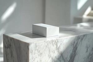 A white cube sitting on top of a marble counter photo