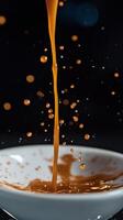 A close up of a cup of coffee being poured into a bowl photo