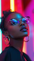 A woman wearing glasses and a colorful dress photo