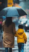 A woman and a child walking in the rain photo