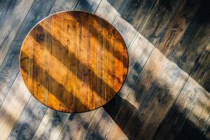 An overhead view of a wooden table on a wooden floor photo