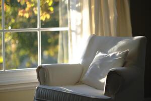 A white chair with a pillow on it photo
