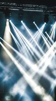 A stage with lights and smoke coming from it photo