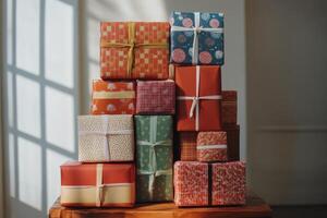 A stack of wrapped presents on a table photo