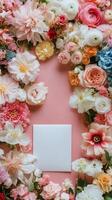 Flowers and card on pink background photo