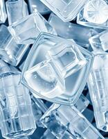 Ice cubes assortment in various shapes and sizes create a cool refreshing atmosphere for drinks at a summer gathering photo