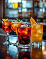 Colorful mixed drinks beautifully arranged on a bar counter with elegant glassware in a lively atmosphere photo