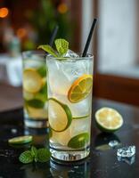 Refreshing lime and mint cocktails served in tall glasses at a trendy bar during a vibrant evening gathering photo