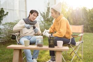 Warm Drinks and Conversation in a Sunny Outdoor Garden During Autumn Afternoon photo