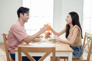 Couple Enjoys Breakfast at a Bright, Modern Dining Table in a Cozy Home Setting photo