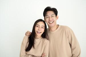 Couple Smiling Together in Matching Outfits, Showcasing a Warm and Friendly Atmosphere at Home photo